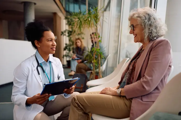 doctor-discussing-with-senior-patient-medical-visit.jpg
