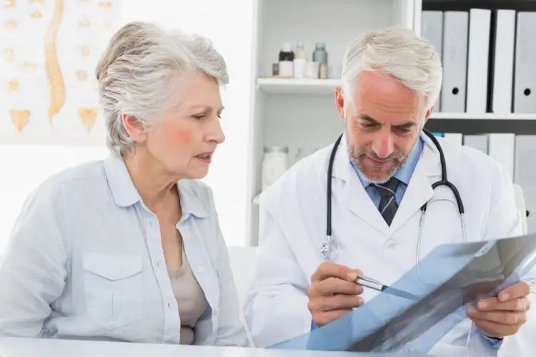 elderly-woman-consulting-doctor-xray.jpg