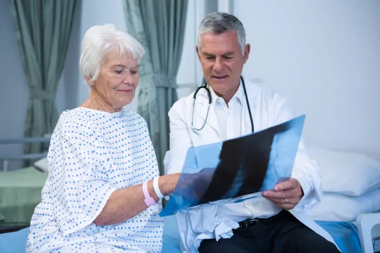 doctor-reviewing-xray-with-elderly-woman.jpg
