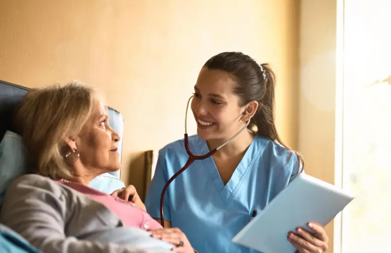 young-nurse-listening-to-elderly-patient-heartbeat.jpg