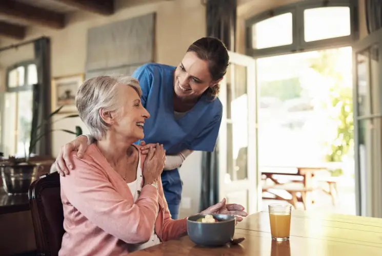 home-nurse-cheerfully-serving-breakfast.jpg