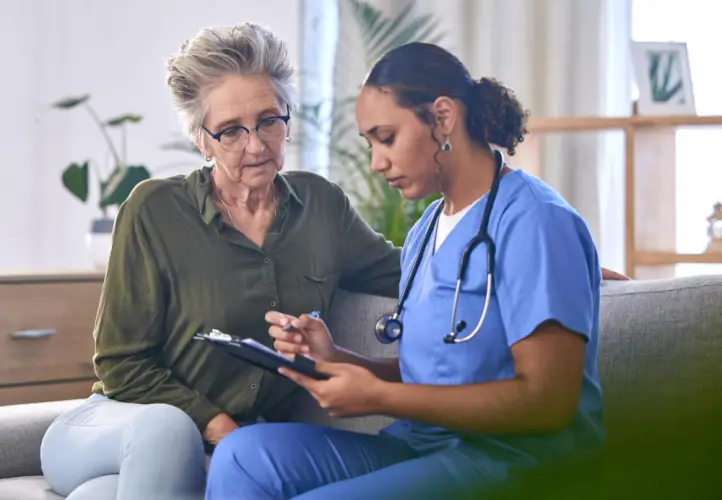 female-nurse-reviewing-health-chart-with-patient.jpg