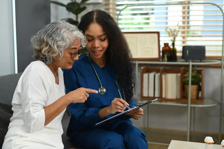 smiling-nurse-discussing-health-with-senior.jpg