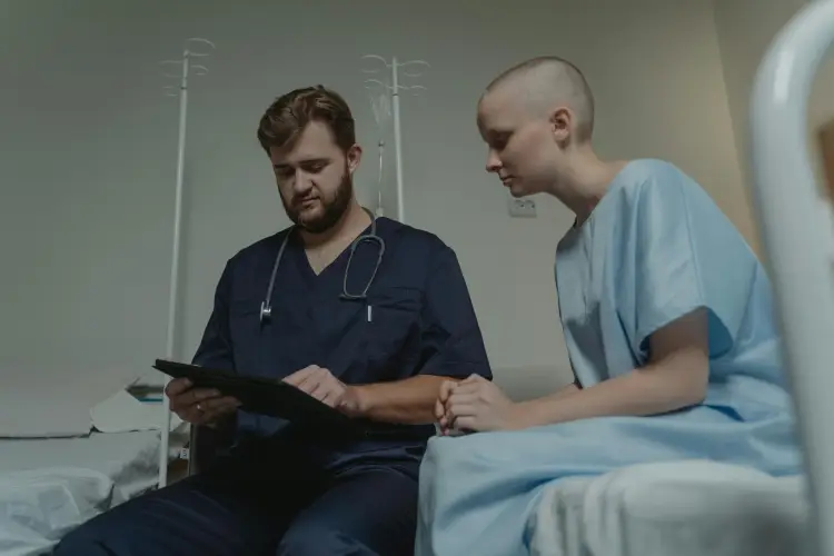 doctor-consulting-patient-in-hospice-setting.jpg
