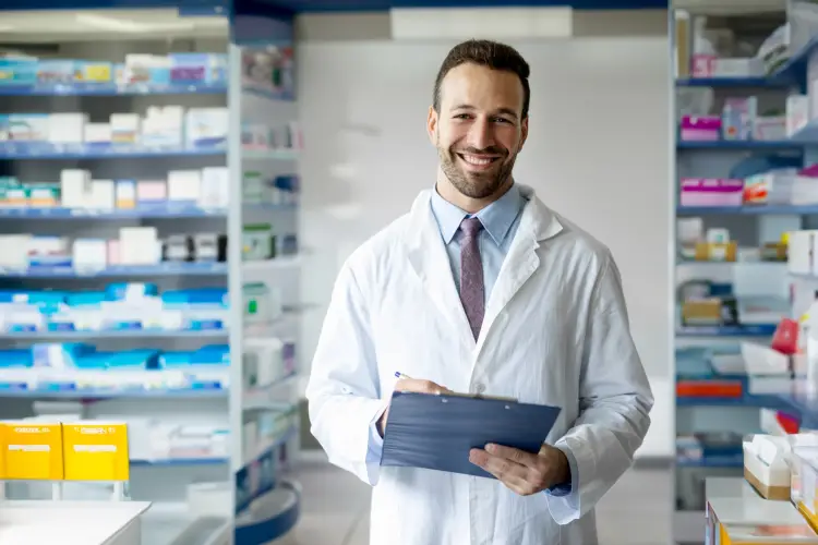 portrait-caucasian-male-young-pharmacist-druggist-white-medical-coat-holding-clipboard-with.jpg