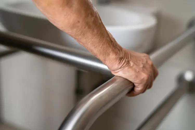 elderly-hand-holding-bathroom-safety-rail.jpg