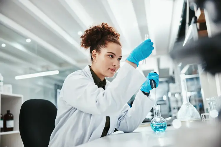 female-lab-technician-conducting-chemical-experiment.jpg