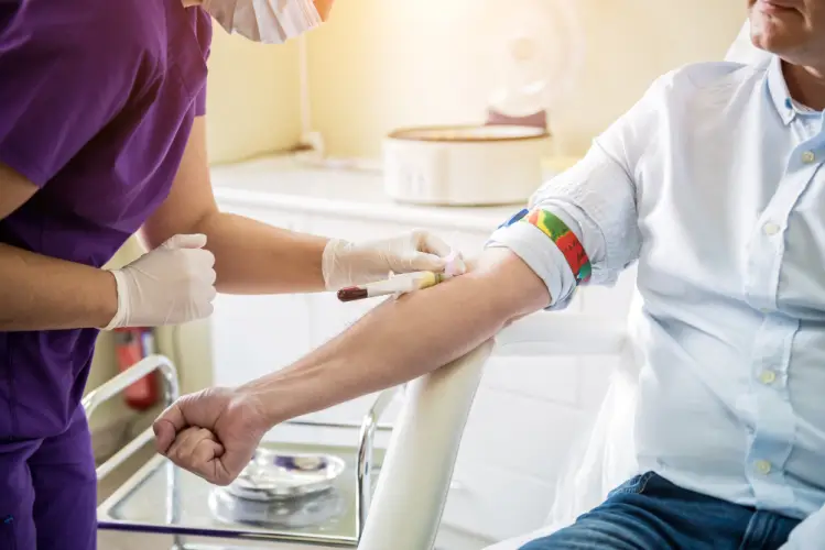 phlebotomist-drawing-blood-male-patient.jpg
