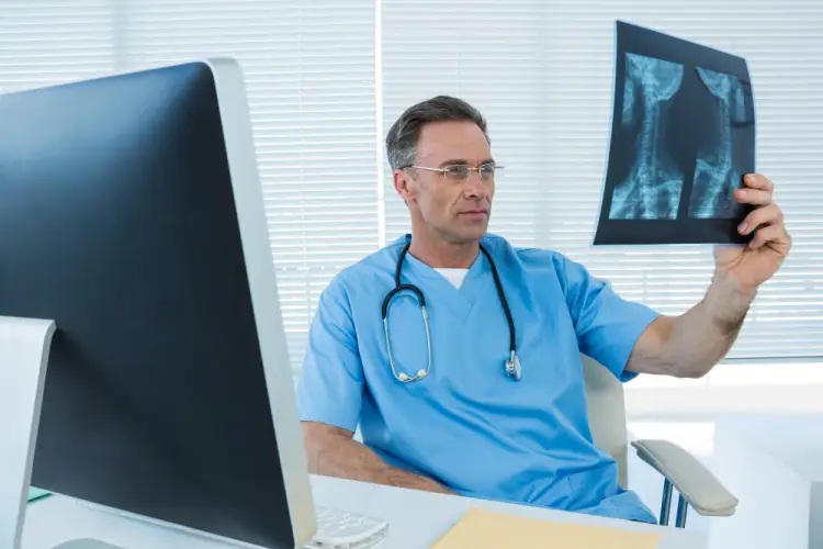 orthopedic-doctor-reviewing-hip-xray-clinic.jpg