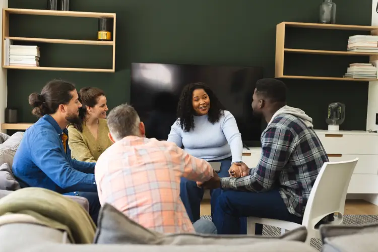 diverse-group-friends-female-therapist-with-tablet-group-therapy-session.jpg