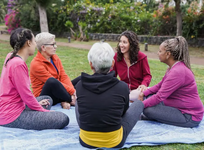 diverse-womens-support-group-sitting-on-blanket.jpg