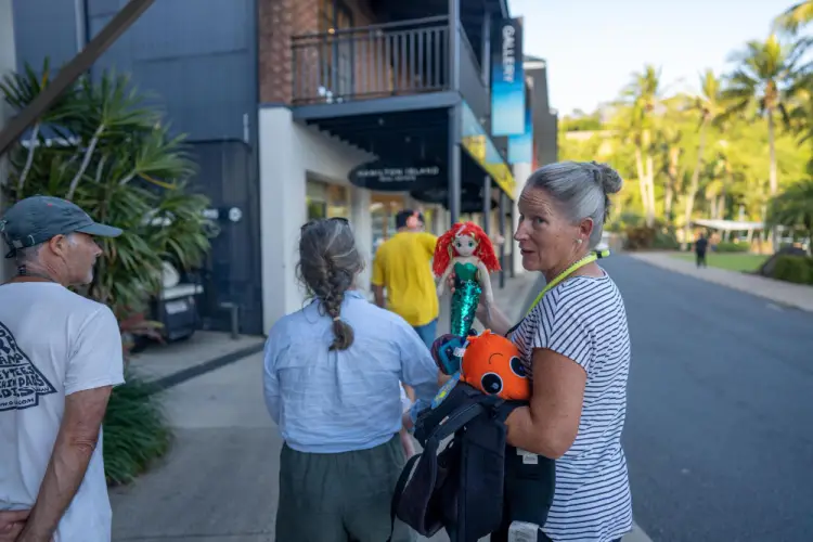 woman-carrying-toys-on-a-shopping-street.jpg