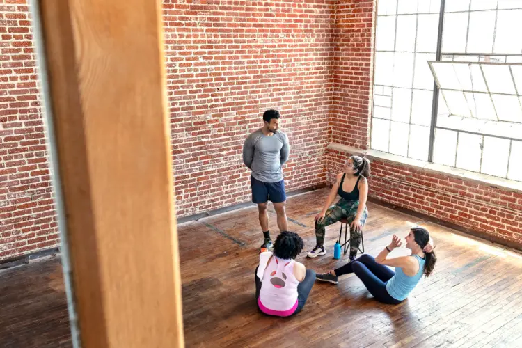 fitness-instructor-talking-to-group-in-studio.jpg