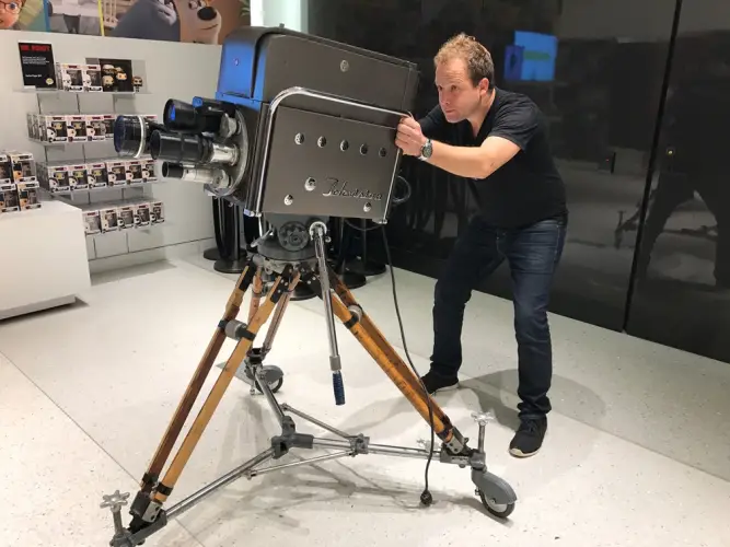 full-length-mid-adult-man-using-equipment-while-standing-workshop.jpg