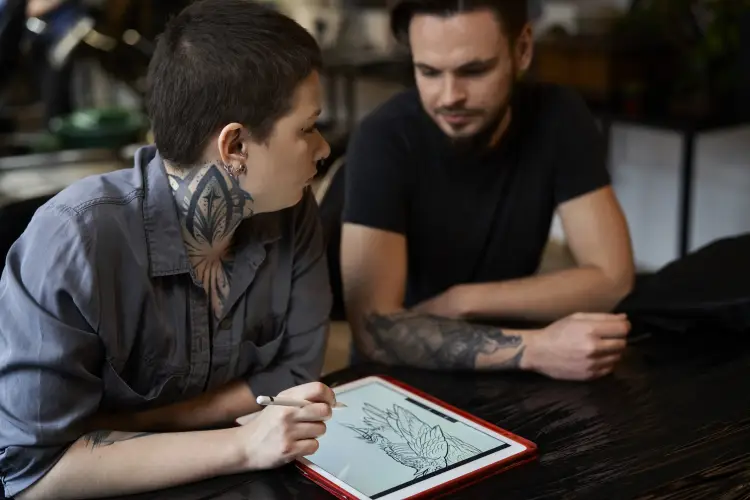 close-up-people-talking-about-new-tattoo.jpg