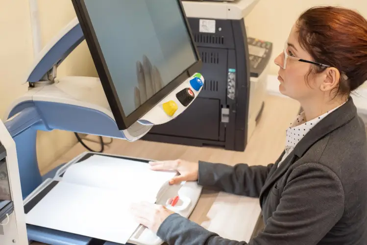 woman-using-high-tech-book-scanner-printing-services.jpg
