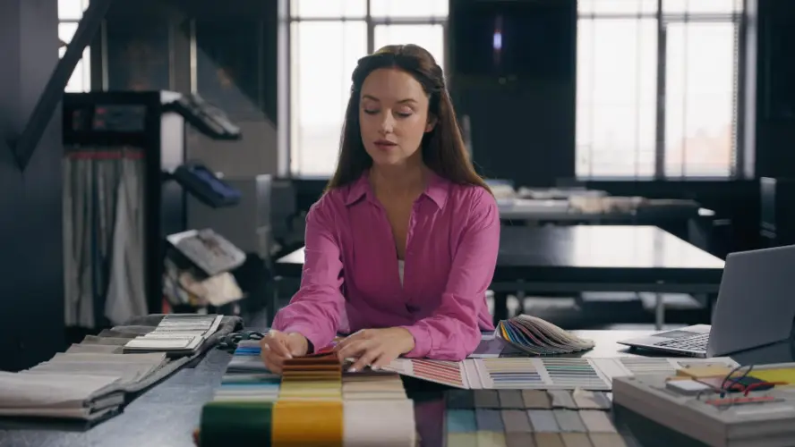 woman-selecting-fabric-swatches-design-studio.jpg