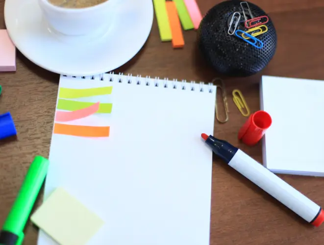 notepad-with-colorful-office-supplies-on-desk.jpg