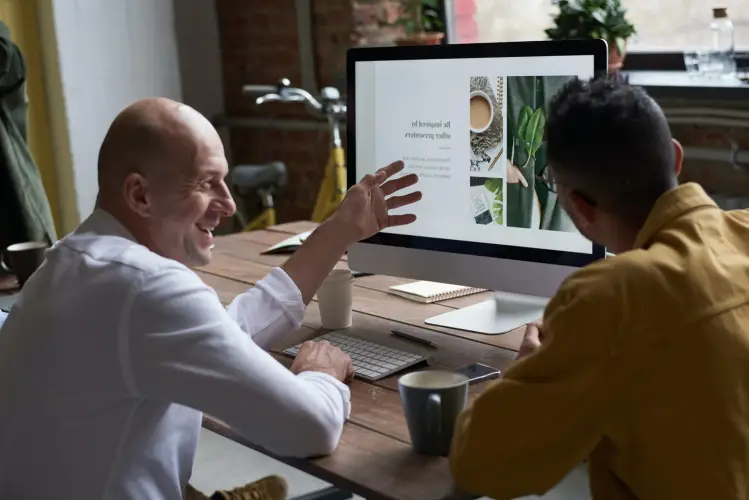 man-woman-are-sitting-desk-with-computer-monitor-that-says-no.jpg