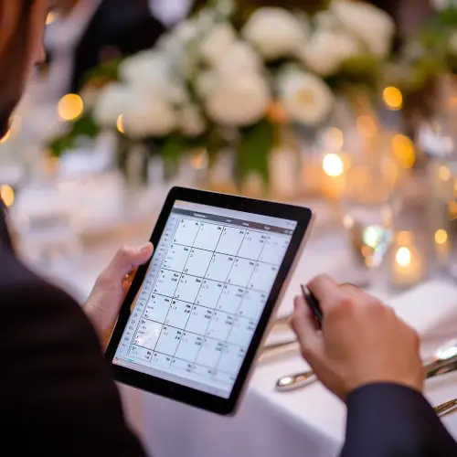 event-planner-using-tablet-to-check-schedule.jpg