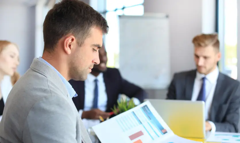 businessman-analyzing-reports-office.jpg