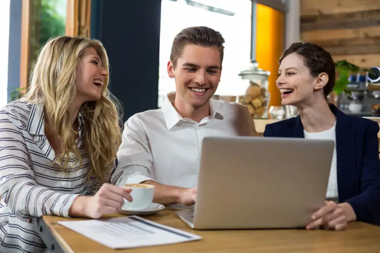 happy-colleagues-with-laptop.jpg