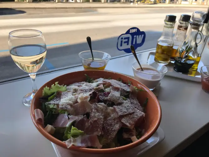 fresh-salad-with-wine-at-restaurant.jpg