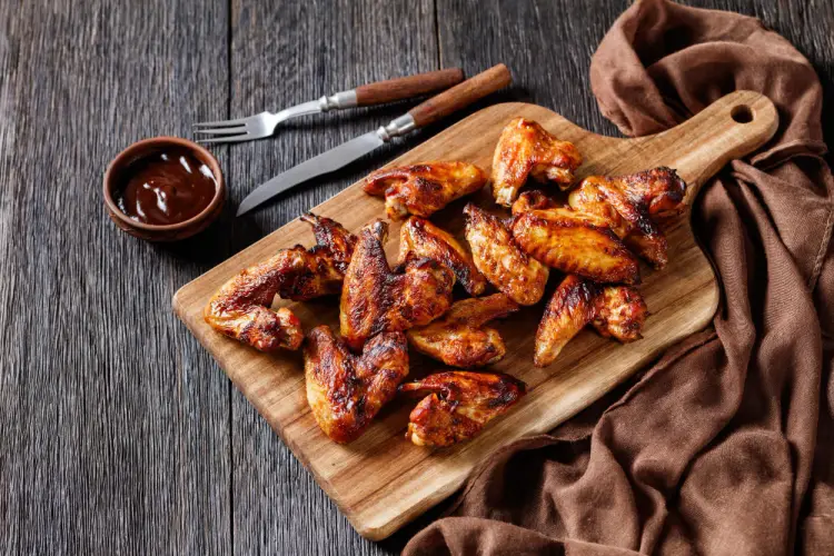 barbecue-chicken-wings-on-board-with-dipping-sauce.jpg