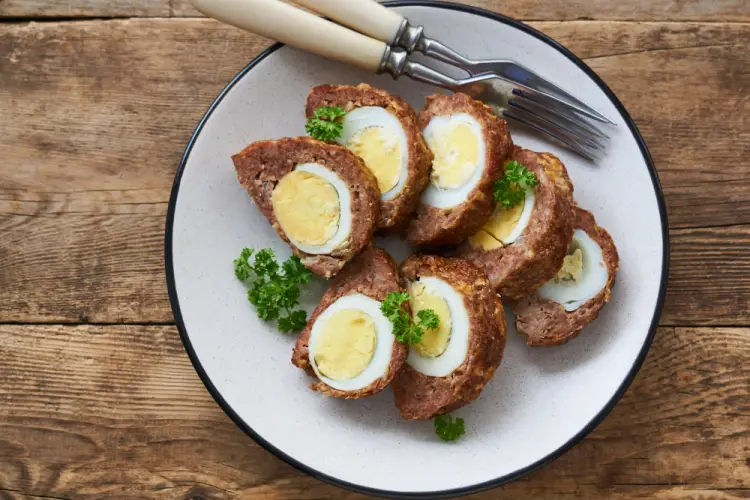 scotch-eggs-sliced-boiled-egg-wrapped-in-sausage.jpg