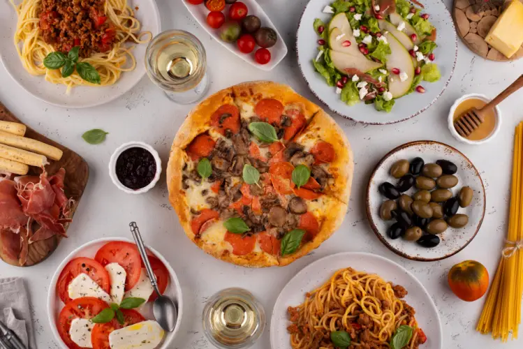 italian_meal_flatlay_pizza_pasta_salad_wine.jpg