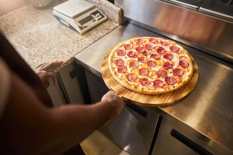 freshly-baked-pepperoni-pizza-on-wooden-paddle.jpg