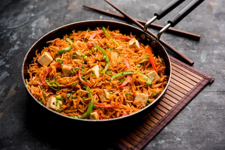 schezwan-paneer-fried-rice-with-szechuan-sauce-cottage-cheese-cubes-served-bowl-plate-pan-selective-focus.jpg