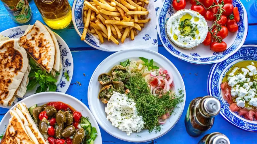 assorted-greek-meze-on-blue-table-with-pita-and-cheese.jpg