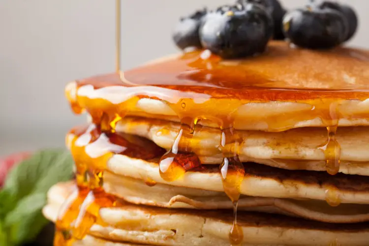 pancakes-with-blueberries-and-maple-syrup-drizzle.jpg