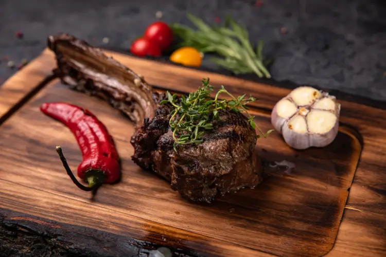 ribeye-steak-on-wooden-board.jpg