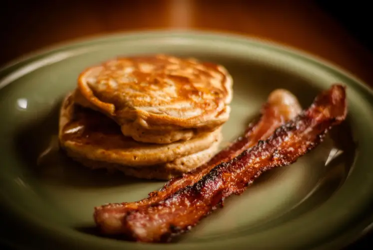 pancakes-and-bacon-on-green-plate-breakfast-dish.jpg
