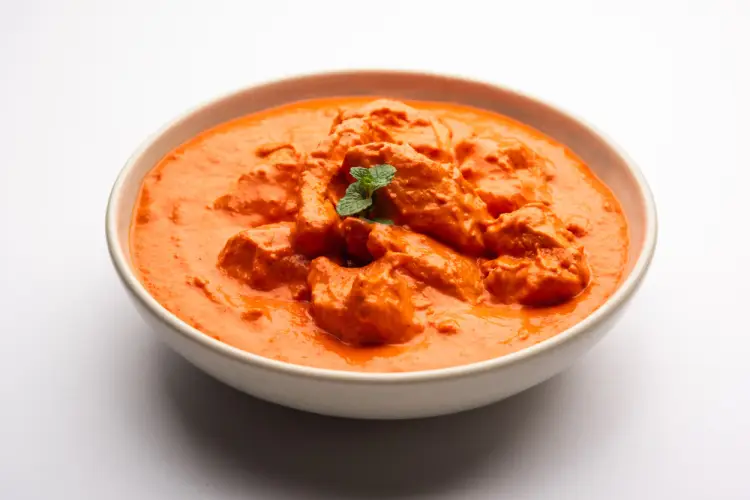 bright-orange-butter-chicken-with-mint-garnish.jpg