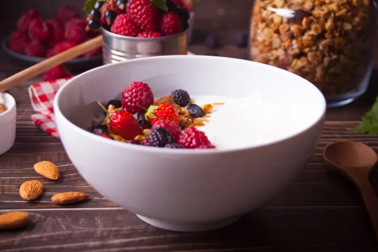 greek-yogurt-with-berries-and-granola-in-white-bowl.jpg