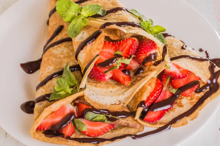 strawberry-crepes-drizzled-with-chocolate-syrup.jpg