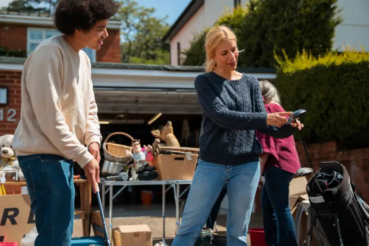 woman-explains-golf-club-garage-sale.jpg